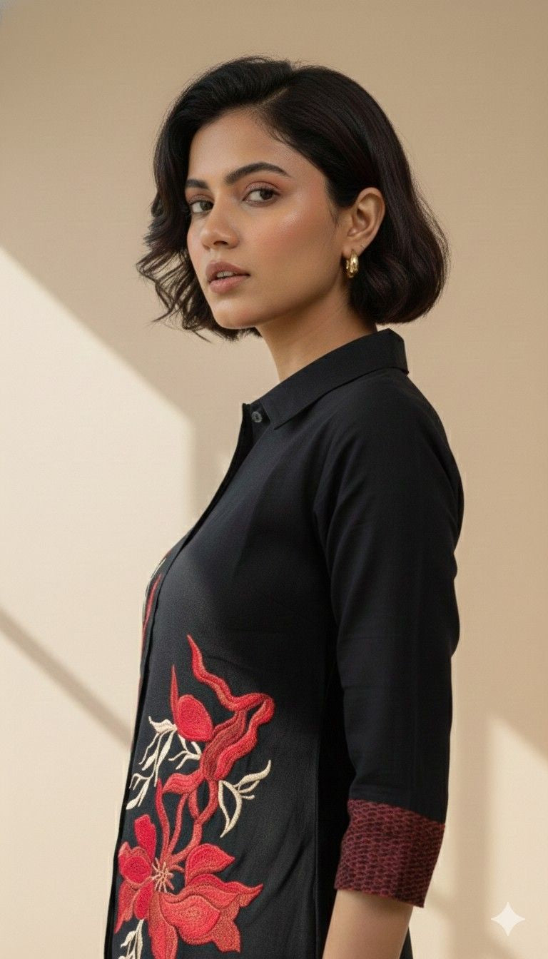 Side view of Black Iris co-ord set highlighting red floral embroidery