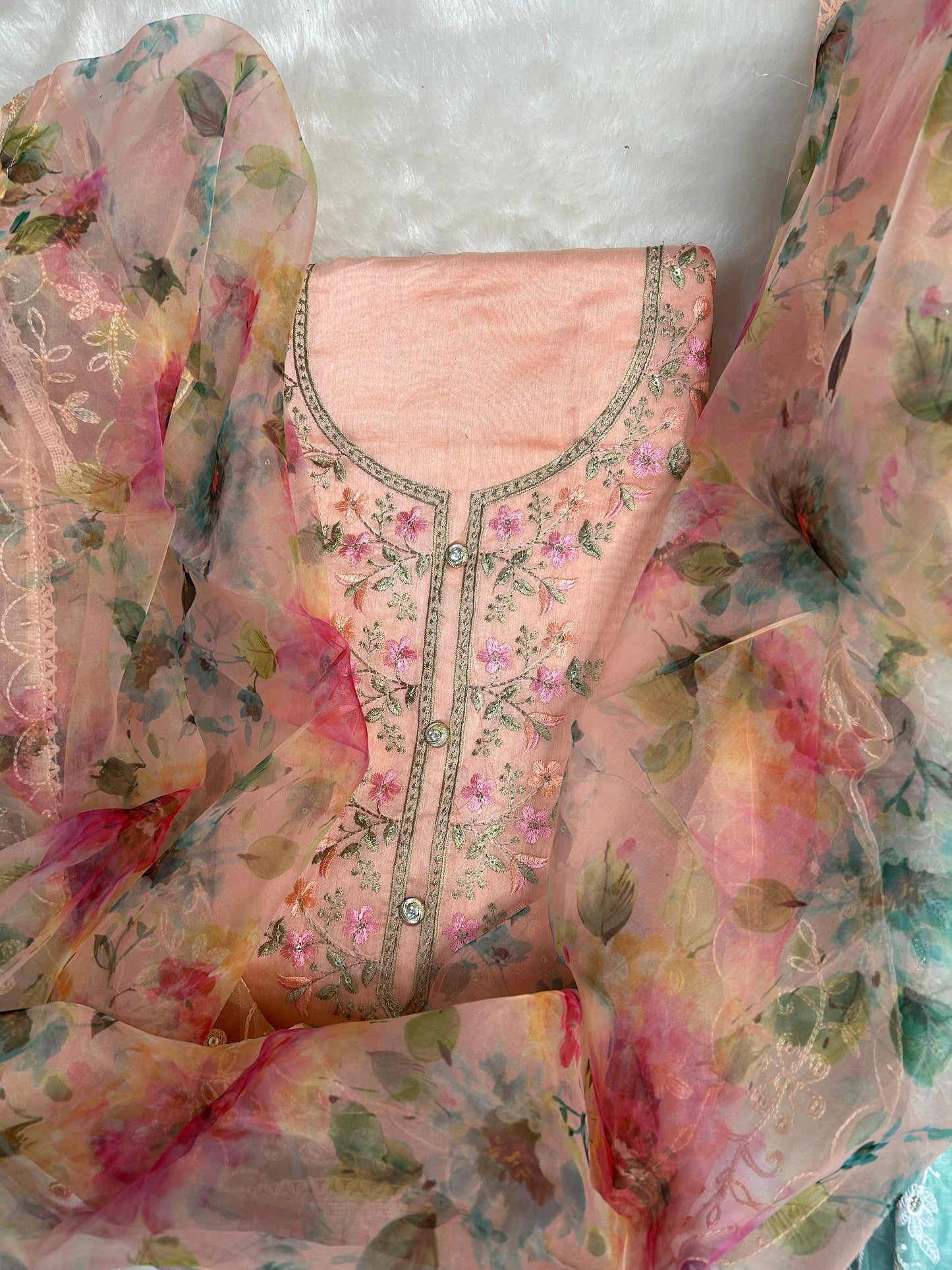 Close-up of the embroidery on the Fully Worked Unique Organza Unstitched Suit, showcasing fine craftsmanship.