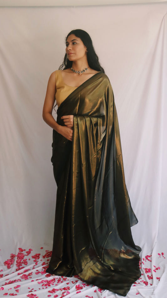 Close-up of the shimmering fabric of the Molten Black Shimmer Saree highlighting its texture and quality.