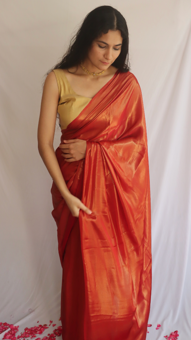 Elegant Ruby Sparkle Shimmer Saree displayed beautifully, showcasing its luxurious shimmer and rich red color.