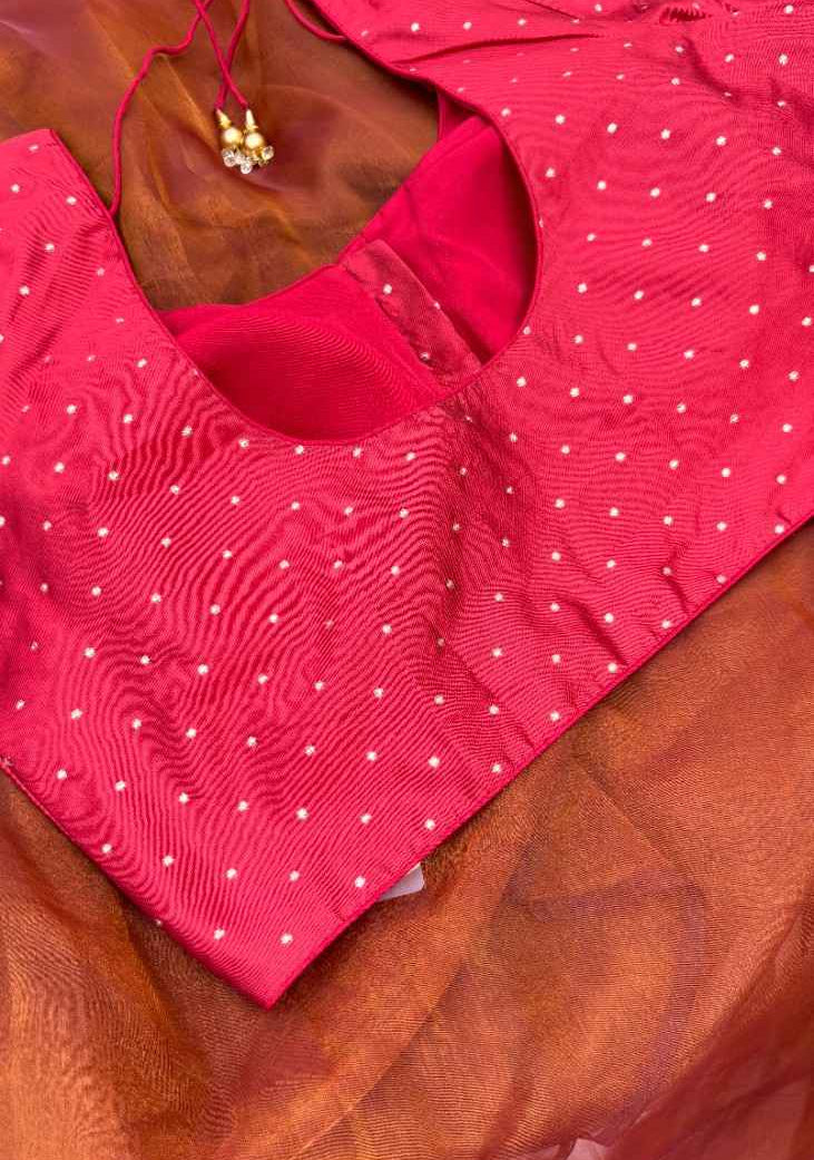 Back view of the Sindoor Gold Polka Blouse featuring adjustable dori tie-up closure. The rich red fabric with gold polka embroidery allows a customizable fit while maintaining elegance for weddings, parties, and festive gathering