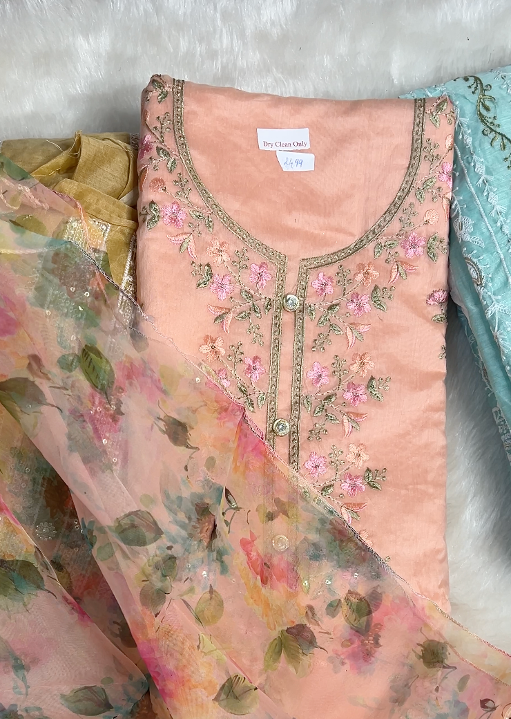 A styled look featuring the Fully Worked Unique Organza Unstitched Suit, demonstrating its elegance when tailored.