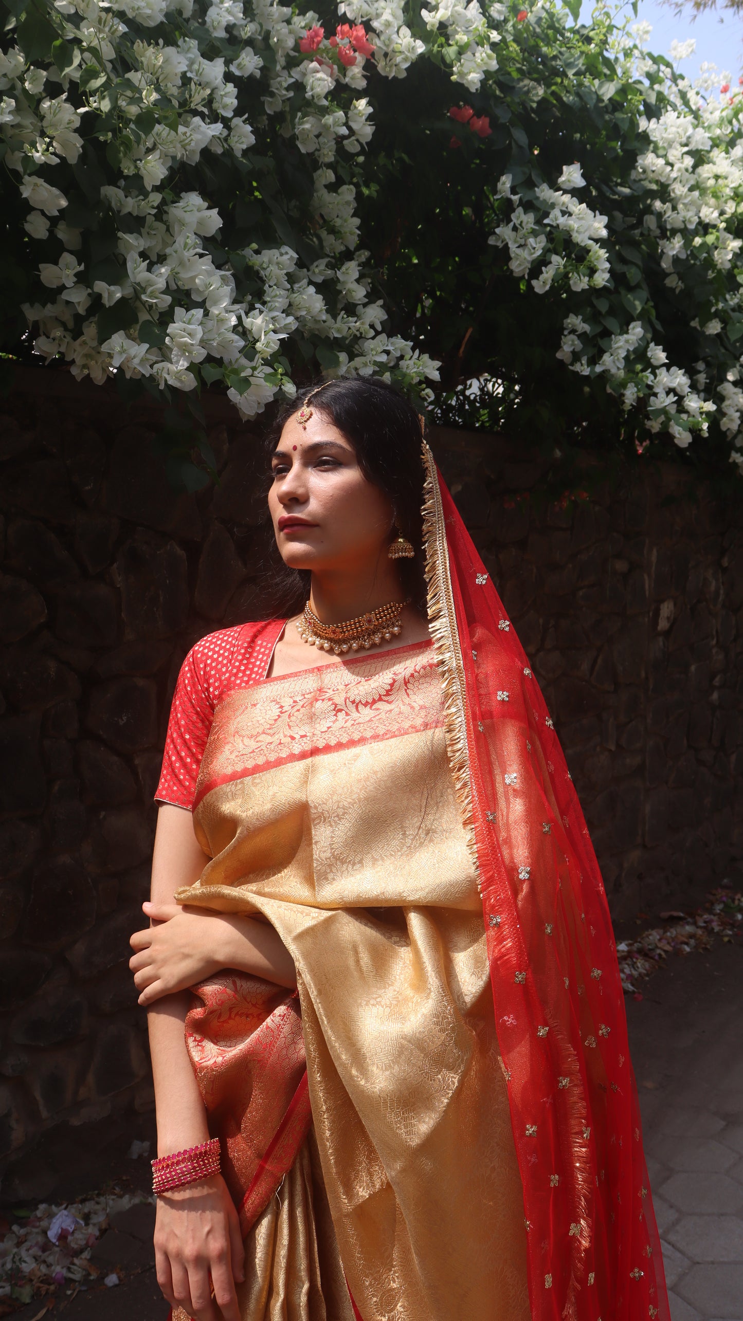 A front view of the Gold Tissue Wedding Saree showcasing its stylish drape and intricate details.