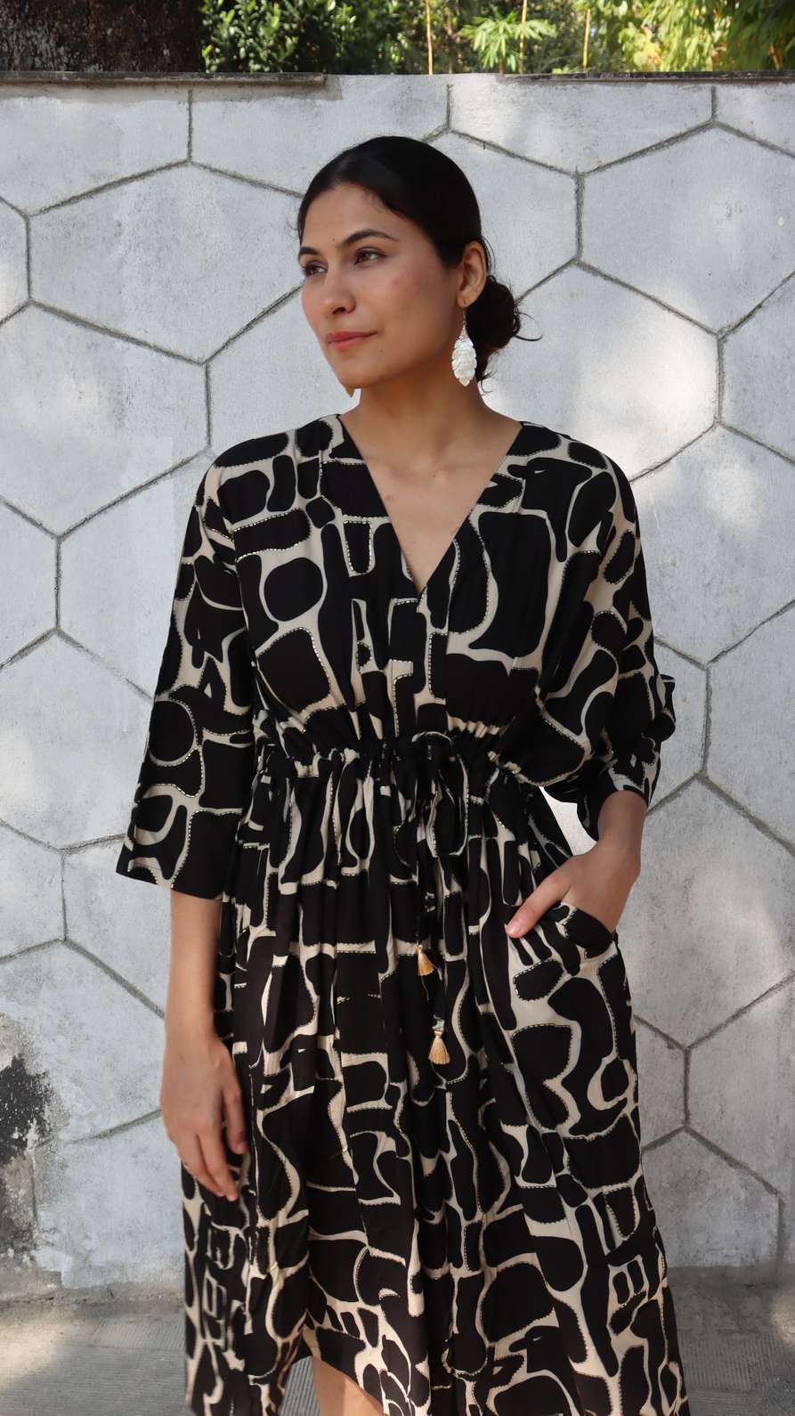 Side pocket detail of abstract rayon free size dress