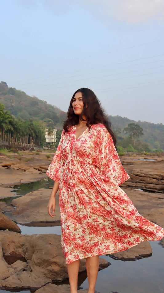 Front view of a free size summer dress in pink floral print made from breathable rayon cotton with a relaxed fit.