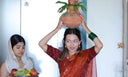 Yashasvini wearing honey queen bee organza saree for her house warming pooja