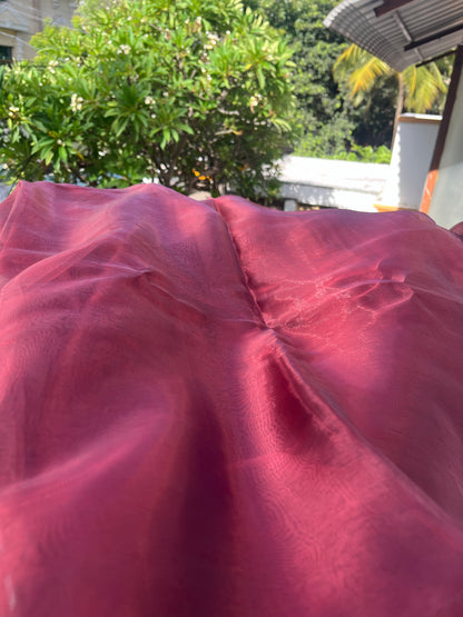 Blood Red saree blouse material elegantly draped on a display, showcasing its vibrant color and luxurious feel