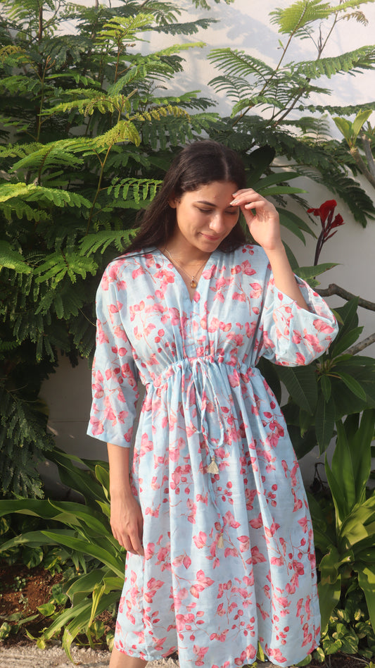 The Bougenville Free Size Dress displayed elegantly, showcasing its vibrant floral print and relaxed silhouette, perfect for any casual outing