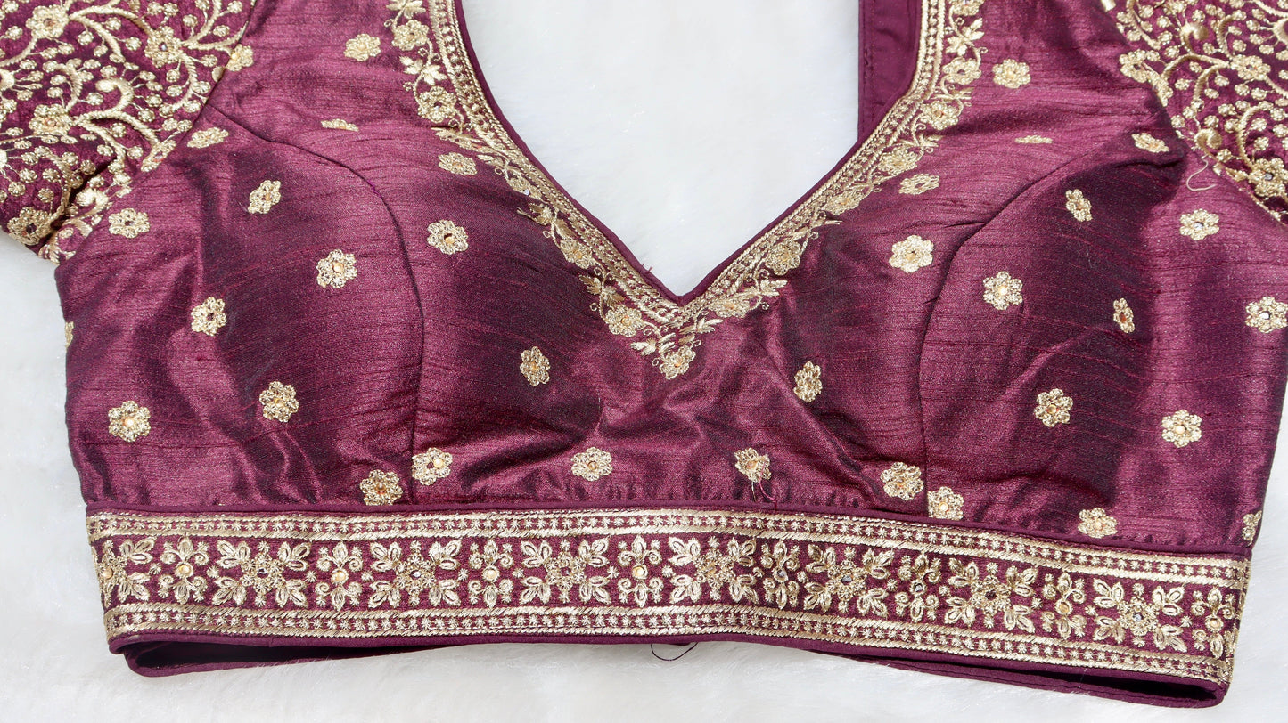 Close up of the intricate thread work details on the yoke of a traditional brown blouse