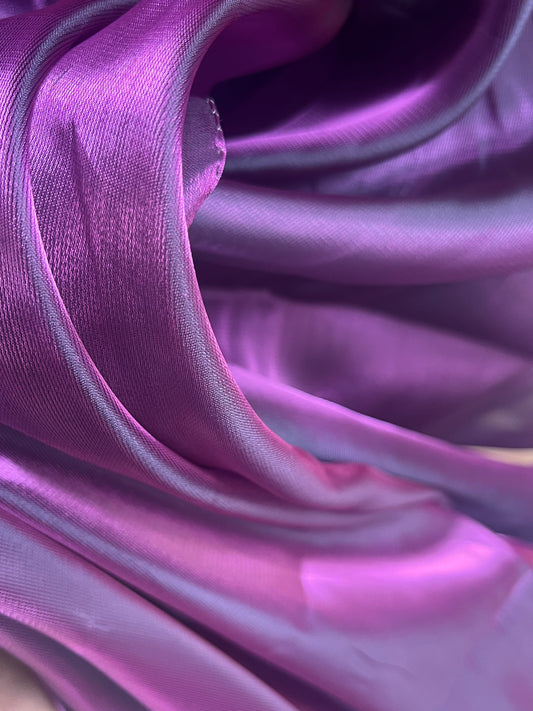 The Bubble Gum Purple Pink Organza Saree beautifully draped, showcasing its vibrant color combination and lightweight fabric, perfect for festive occasions.