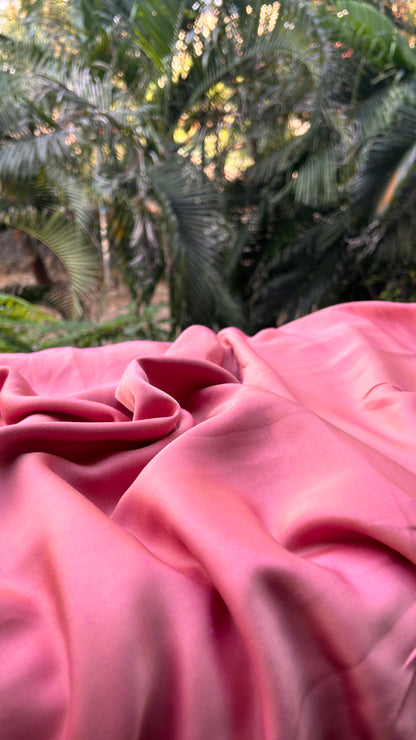 Close-up view of the soft fabric texture highlighting the intricate weave of the Shades of Pink Reversible Saree.