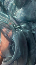 Close up of dark blue organza blouse