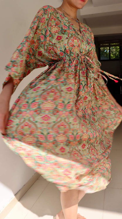 Lifestyle image of the Meadow Paisley Free Size Crepe Pocket Dress showing its airy fall, adjustable waist tie, and comfortable plus-size friendly fit