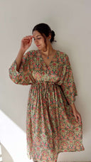 Lifestyle image of the Meadow Paisley Free Size Crepe Pocket Dress showing its airy fall, adjustable waist tie, and comfortable plus-size friendly fit.