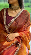 Person wearing honey organza with gold border by Label Anaira, Chennai