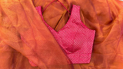 Styled look of Label Anaira’s Mango Bloom Red Blouse paired with a festive honry queen bee saree. Sleeveless design with gold mango (paisley) motifs and optional short sleeves offer elegance, comfort, and versatility for special occasions