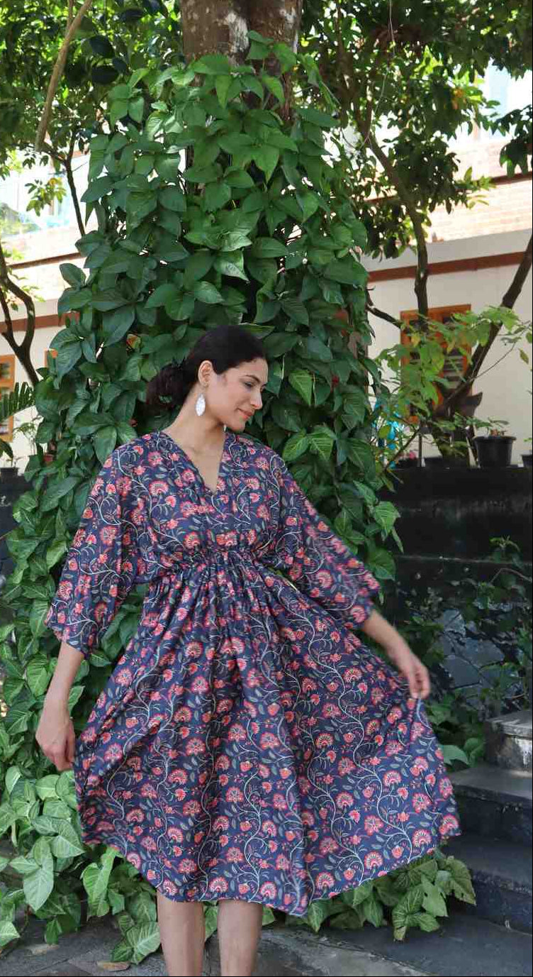 Front view of a free size summer dress in indigo floral print made from breathable rayon cotton with a relaxed fit.