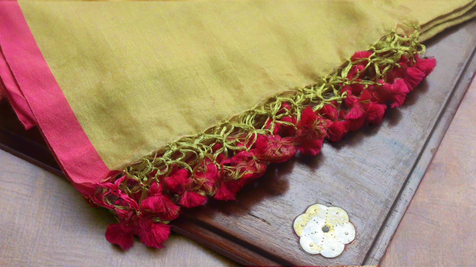 Detailed view of the intricate patterns on the Lime Pink Cotton Tissue Saree, showcasing exquisite craftsmanship.