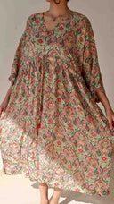 Front view of the Meadow Paisley Free Size Crepe Pocket Dress featuring a soft green base, floral paisley print, flowy silhouette, and breathable crepe fabric.