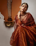 Shriya in Queen Bee in traditional attire with jewelry in a decorative setting