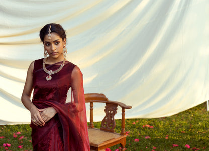 A model elegantly draped in the Blood Red Semi Organza Saree, showcasing its beautiful fit and vibrant color