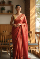 Model wearing red satin silk saree with gold shimmer finish and fluid drape
