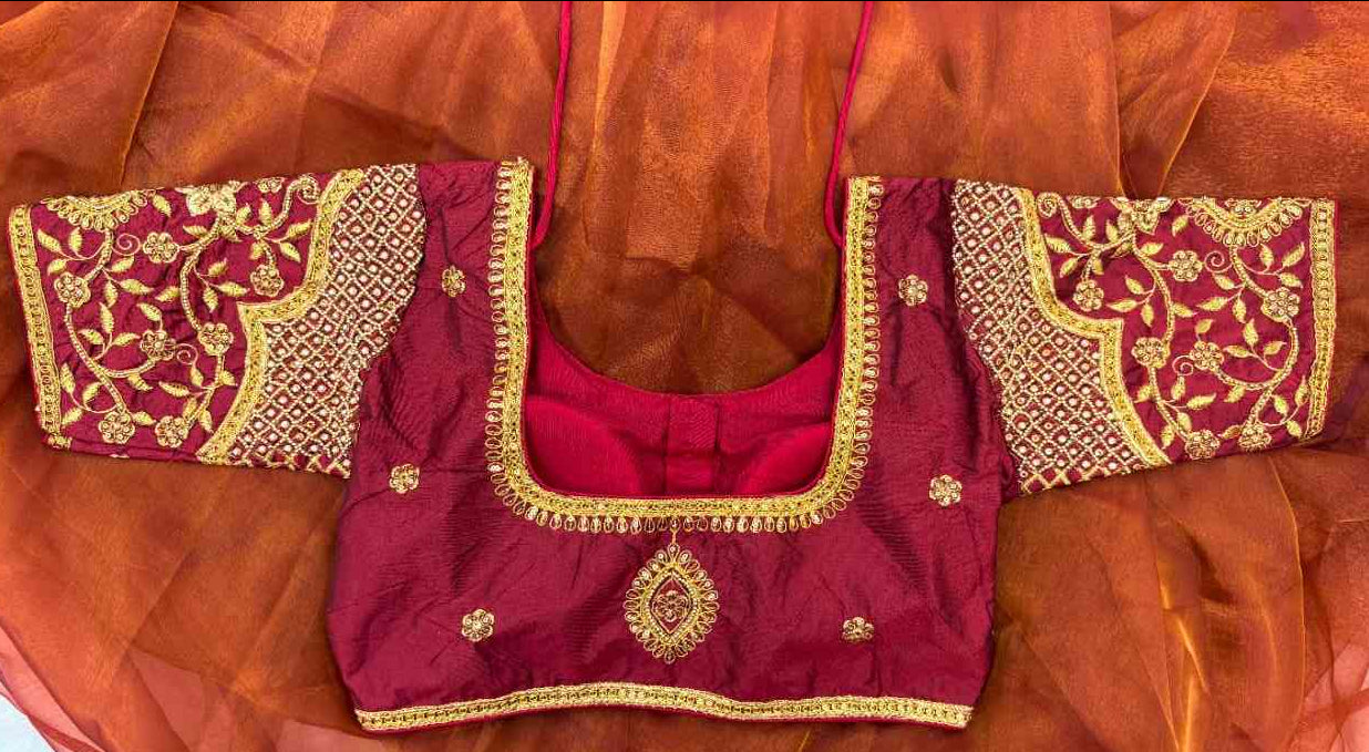 Back view of the Noor-e-Zari Blouse showcasing the dori tie-up closure and full gold embroidery. The blouse features floral and paisley sleeve motifs and a dense geometric body pattern, offering a customizable fit while exuding luxurious festive elegance.