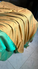 Teal green and Mango Reversible Saree on a tiled floor