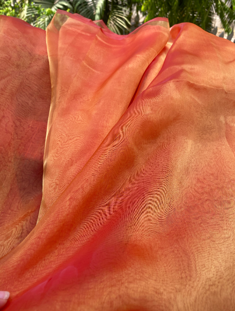 Pehli kiran orange organza saree glowing so beautifully under the sunlight, the material is breathable and extremely soft