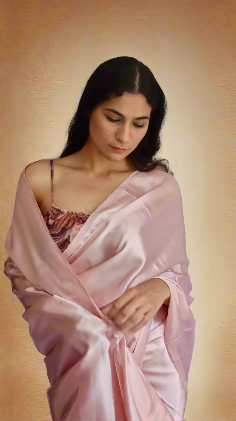 woman wearing pretty light minimalistic satin saree