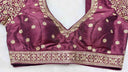 Purple blouse with gold embroidery on a white background