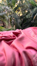 Close-up Shades of Pink - Reversible Saree with a blurred natural background