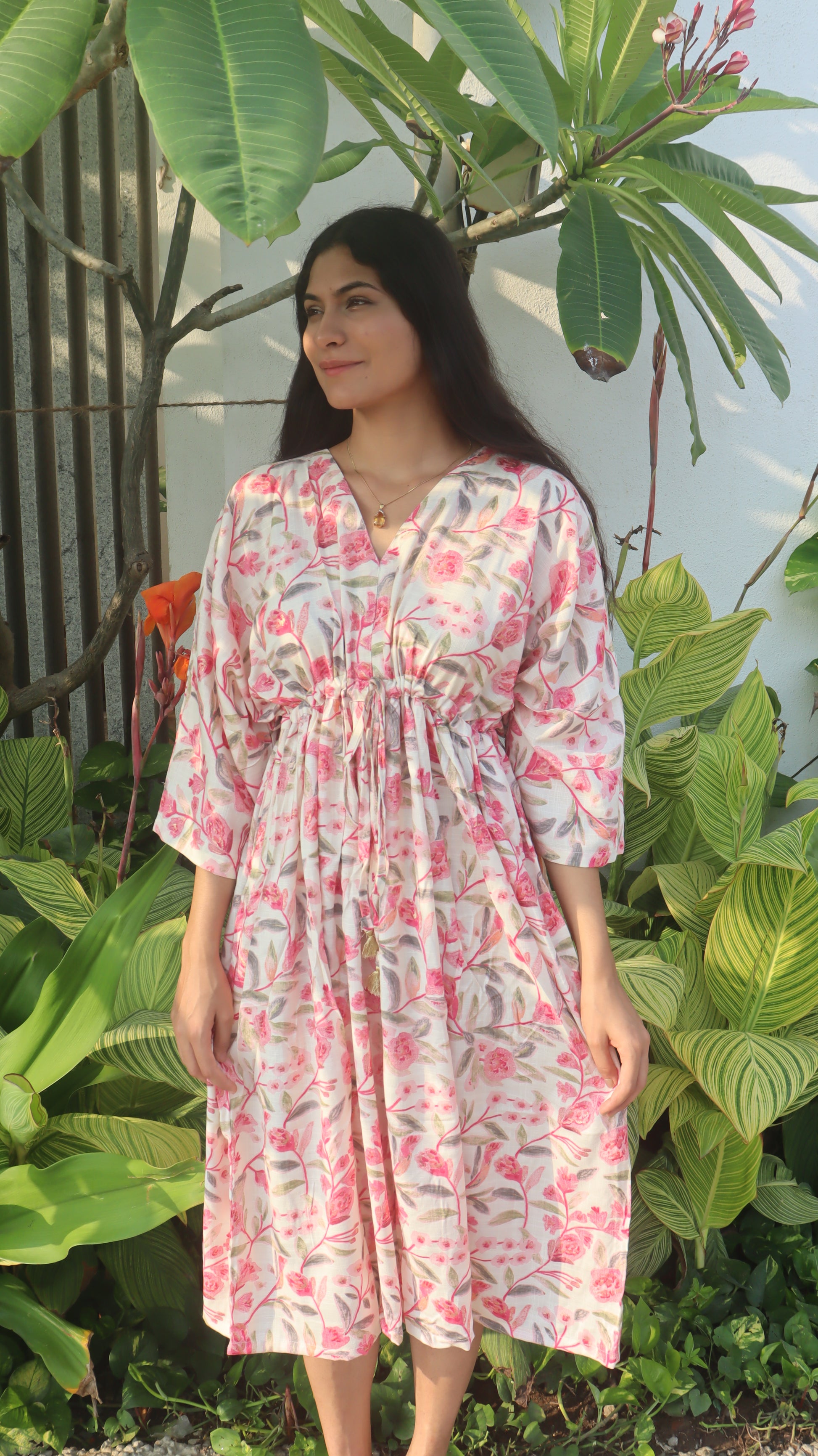 Back view of the Summer Breeze Free Size Dress, highlighting its elegant drape and design details.