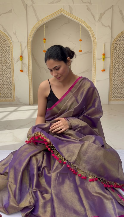 Woman wearing a purple saree very unique easy to drape on a festive background