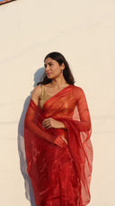 Detail view of the A Scandal Worth Wearing Scarlet Organza Saree by Label Anaira featuring sheer premium organza fabric and a soft luminous scarlet tone.