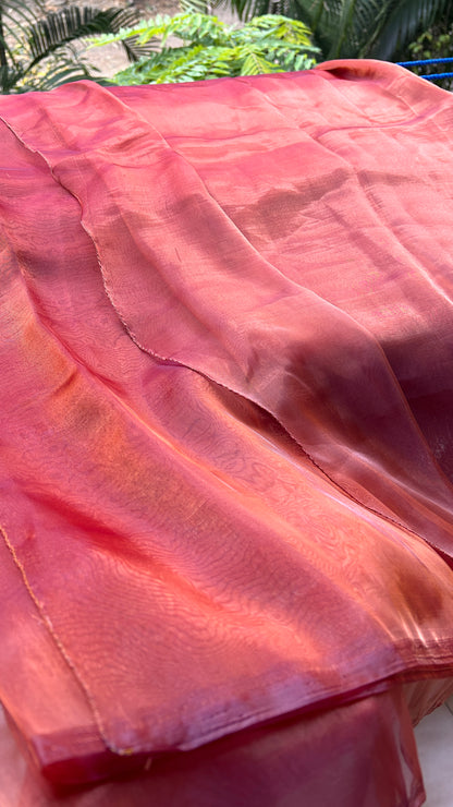 an image showing red maroon orange pink and gold shade organza saree