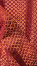Close-up of a textured fabric with a leaf pattern on a red background