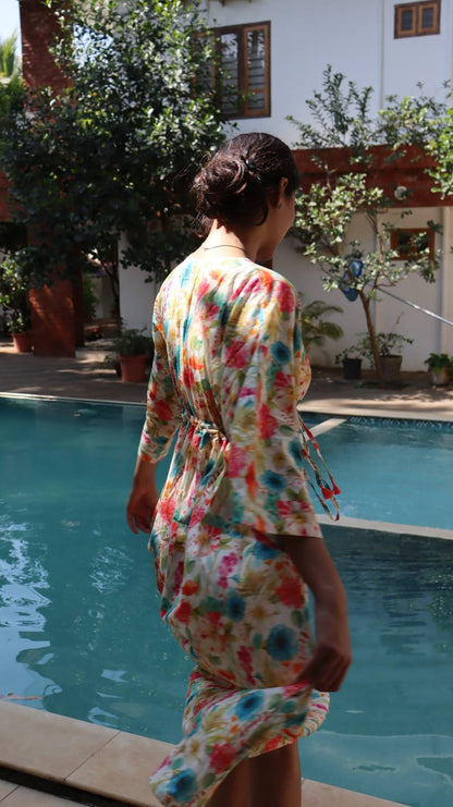 Back view of blue floral rayon dress with flowy silhouette