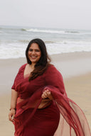 Blood Red Organza Saree pallu in motion showing sheer glow in natural light — party wear saree by Label Anaira