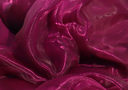 Close-up of a textured purple organza fabric with folds