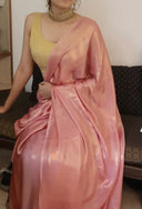 Model seated in Blushing Bride Pink Satin Silk Saree with minimal jewellery, close view of gold shimmer — Label Anaira