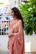 Side drape view of Blushing Bride Pink Satin Silk Saree with gold shimmer against greenery — Label Anaira