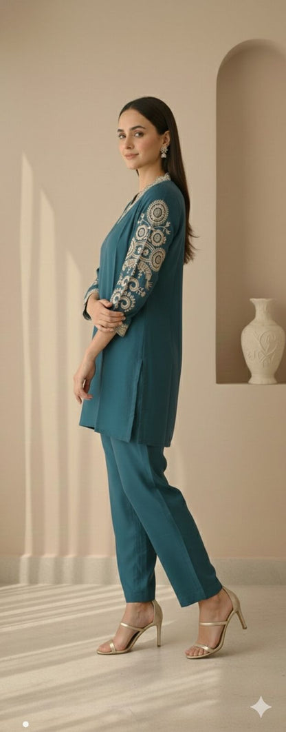Evergreen embroidered co-ord set in a relaxed side pose