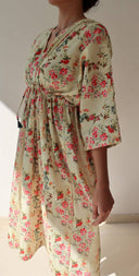 SIde view of floral linen dress with flowy silhouette