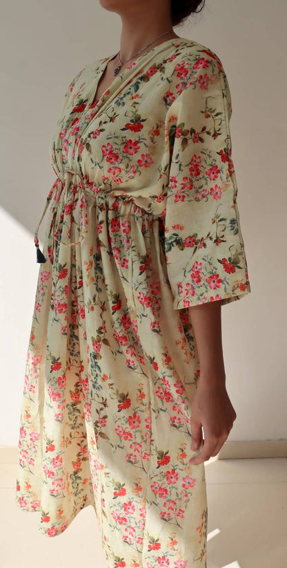 SIde view of floral linen dress with flowy silhouette