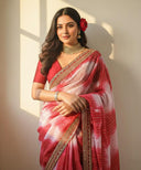 Model wearing Gulnaar Grace red organza saree with gold embellished border – front view