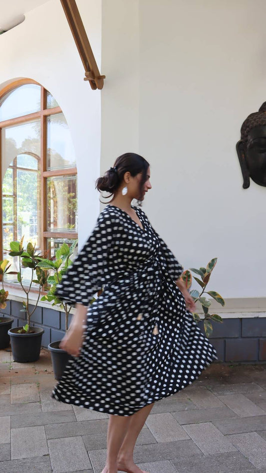 Full length view of black polka dot satin dress for women