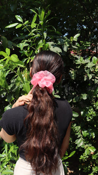 Baby Pink organza scrunchie in a low ponytail