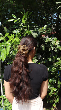Black and Gold Glimmering Shadows organza scrunchie in a low ponytail