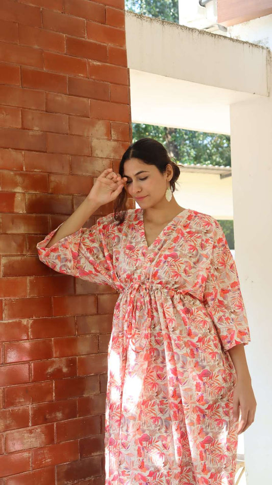 Peach floral leaf print rayon free size dress with pockets for women, relaxed pose